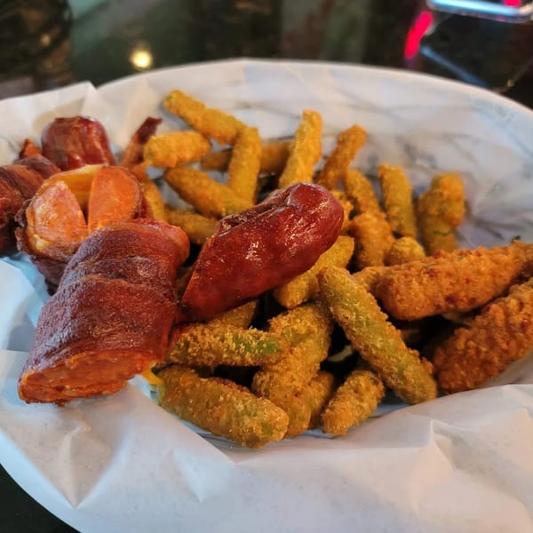 A basket of Jams@209 Sports Bar & Grill's fried green beans and bacon-wrapped jalapeños.