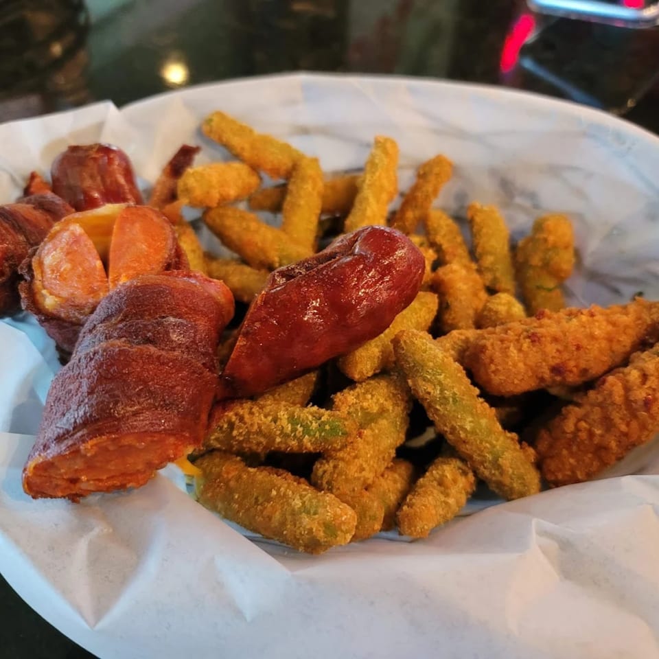 A basket of Jams@209 Sports Bar & Grill's fried green beans and bacon-wrapped jalapeños.